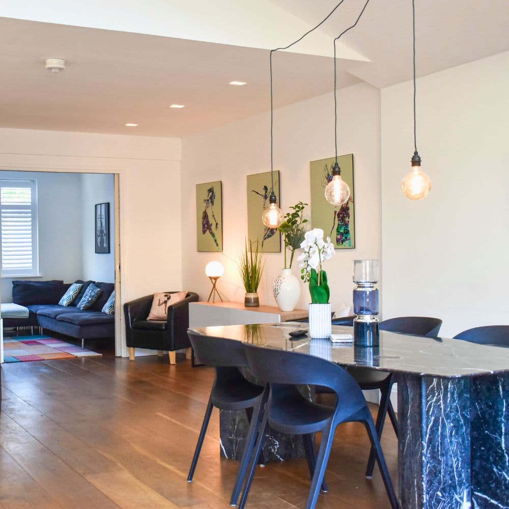 Pendant bulb lights installed above a dining table in Twickenham